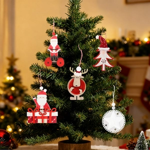 Close-up of wooden Santa and reindeer ornaments hanging on a Christmas tree branch