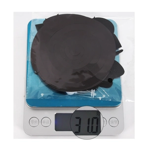 Functional shot showing the exact weight of 31.0g for the black spiral pendant on a digital scale