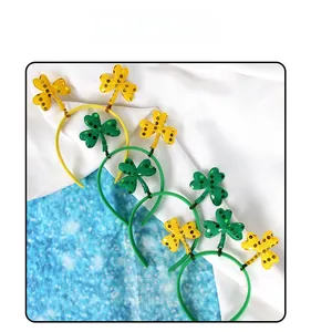 Close-up of four St. Patrick's Day headbands with sequins shamrock and LUCK letters