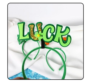 Detail of St. Patrick's Day headband with LUCK text, sequins and green clover motifs