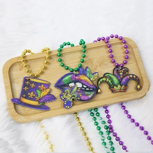 Three-piece Mardi Gras beaded necklaces with glittery hat, lips, and joker pendants