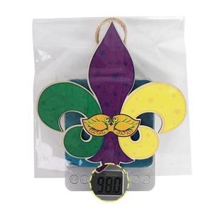 Detailed view of Mardi Gras fleur-de-lis wood sign with mask and stars on scales