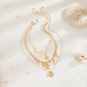 Collier multicouche doré thème océan avec pendentifs étoile de mer coquillage et perles