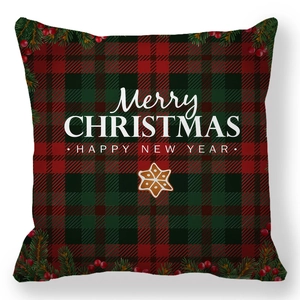 Christmas red and green plaid pillow cover with pine branches and Merry Christmas text