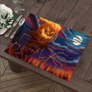 Macro detail of Nordic Halloween linen placemat featuring glowing Jack-o-lantern and spooky tree