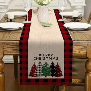 Detailed texture of Christmas table runner with red buffalo plaid and holiday trees