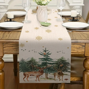 Close-up of linen Christmas table runner featuring reindeer and pine tree patterns