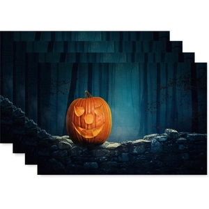 Set of four Nordic Halloween linen placemats with Jack-o'-lantern pumpkin and forest design