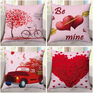 Set of four Valentine's Day pillow covers with pink hearts and red truck prints