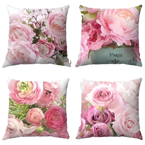Set of four square pillow covers with pink floral patterns and Paris vintage lettering