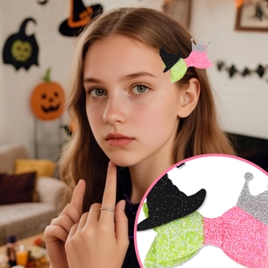 Glitter fabric Halloween bow clip with witch hat and crown details on green and pink bow