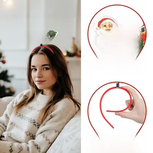 Stretchy Christmas headband showing flexible frame and Merry Christmas decorative top