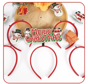Detail of Christmas headbands with glittery snowman, gift boxes and festive decorations