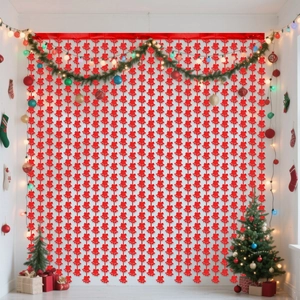 Close-up of vibrant red snowflake tinsel curtains for festive Christmas wall decoration