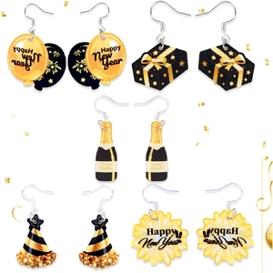 Detailed close-up of 5 pairs of Happy New Year acrylic earrings with champagne and balloon motifs