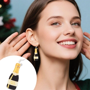 Detail of creative black and gold wine bottle acrylic earrings on a holiday party model