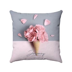 Artistic square pillow with ice cream cone and pink roses pattern on gray background