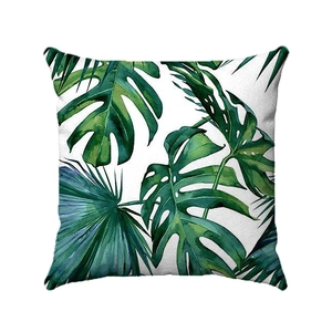 Close-up of tropical monstera palm leaf pattern on soft square decorative pillowcase