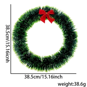 Green 38cm Christmas wreath decoration with bright tinsel and a large red ribbon bow