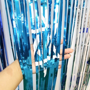 Close-up of blue Hanukkah tinsel curtain with white Star of David foil fringe pattern