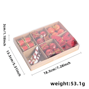 Christmas tree red ornament set with balls, bows and candy canes in a kraft gift box