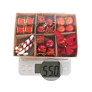 Weight display of Christmas ornament set with baubles and bows in a gift box