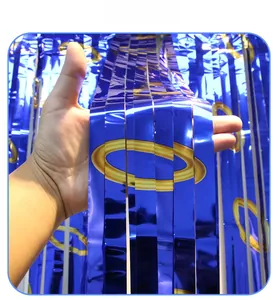 Detail of blue foil fringe curtain with gold ring pattern for party backdrop decoration