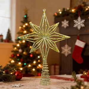 Close-up of golden glitter Christmas tree topper star with spiral spring base stand