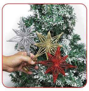 Detailed view of hollow star tree toppers in red gold and silver with glitter finish