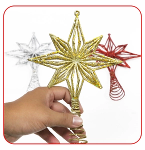Close-up of three-piece glittery octagonal star tree toppers in gold, silver, and red