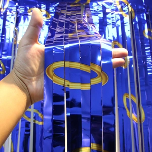 Deep blue fringe curtain background with golden ring patterns for birthday party decor