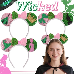 Close-up of four sequined Wicked theme headbands with broom and crown details