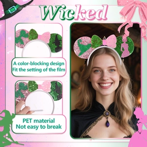 Close-up of Wicked movie-themed headband with pink and green sequins and silhouettes