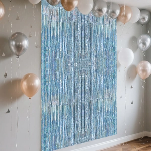 Close-up of blue holographic tinsel fringe curtain with balloons for party backdrop decoration
