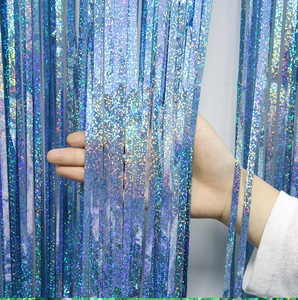 Detail of blue laser fringe curtain showing holographic texture and high-density strands