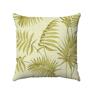 Detail of Nordic tropical palm leaf print on beige linen cotton sofa cushion cover