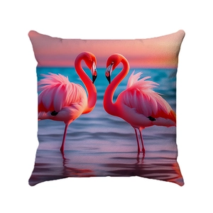 Dettaglio della federa per cuscino con fenicotteri rosa a forma di cuore al tramonto