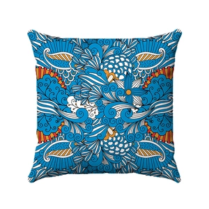 Macro shot of geometric bohemian throw pillow cover with vibrant mandala floral patterns