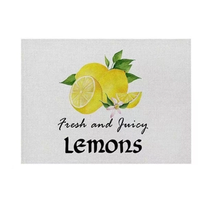 Detail of linen texture place mat featuring fresh yellow lemon botanical printing