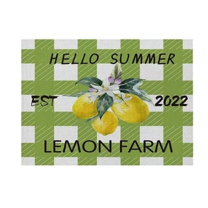 Detail of cotton linen placemat with lemon pattern and Hello Summer typography print