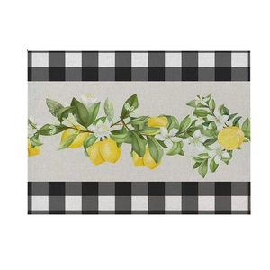 Detailed view of linen texture placemat featuring lemon patterns and buffalo check borders