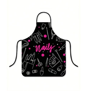 Detail view of professional black nail salon apron with pink Nails text and white tools