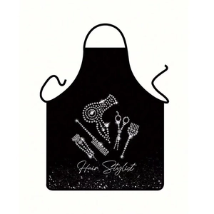 Close-up of hair stylist apron with rhinestone hair dryer and comb patterns