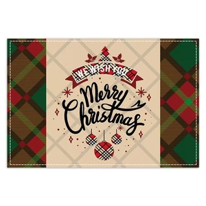 Close-up of festive Christmas placemat with red-green plaid and Merry Christmas text