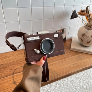 Chic vintage-style brown suede camera bag with rhinestone details and metal hardware