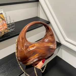Chic amber marble acrylic clutch bag with round top handle and gold metal chain strap