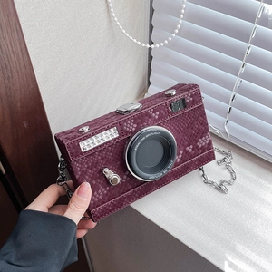 Creative camera-shaped crossbody bag in purple snakeskin leather with metal chain