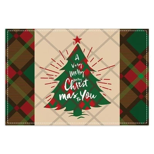 Close-up of Christmas placemat featuring red and green plaid with a festive tree pattern