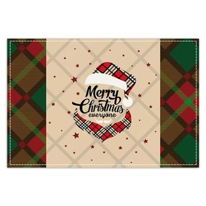 Detail of Christmas elk placemat with red-green plaid pattern and festive greeting