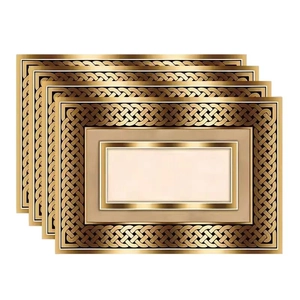 Set of 4 black and gold geometric table mats with bohemian Celtic knot heat-resistant design